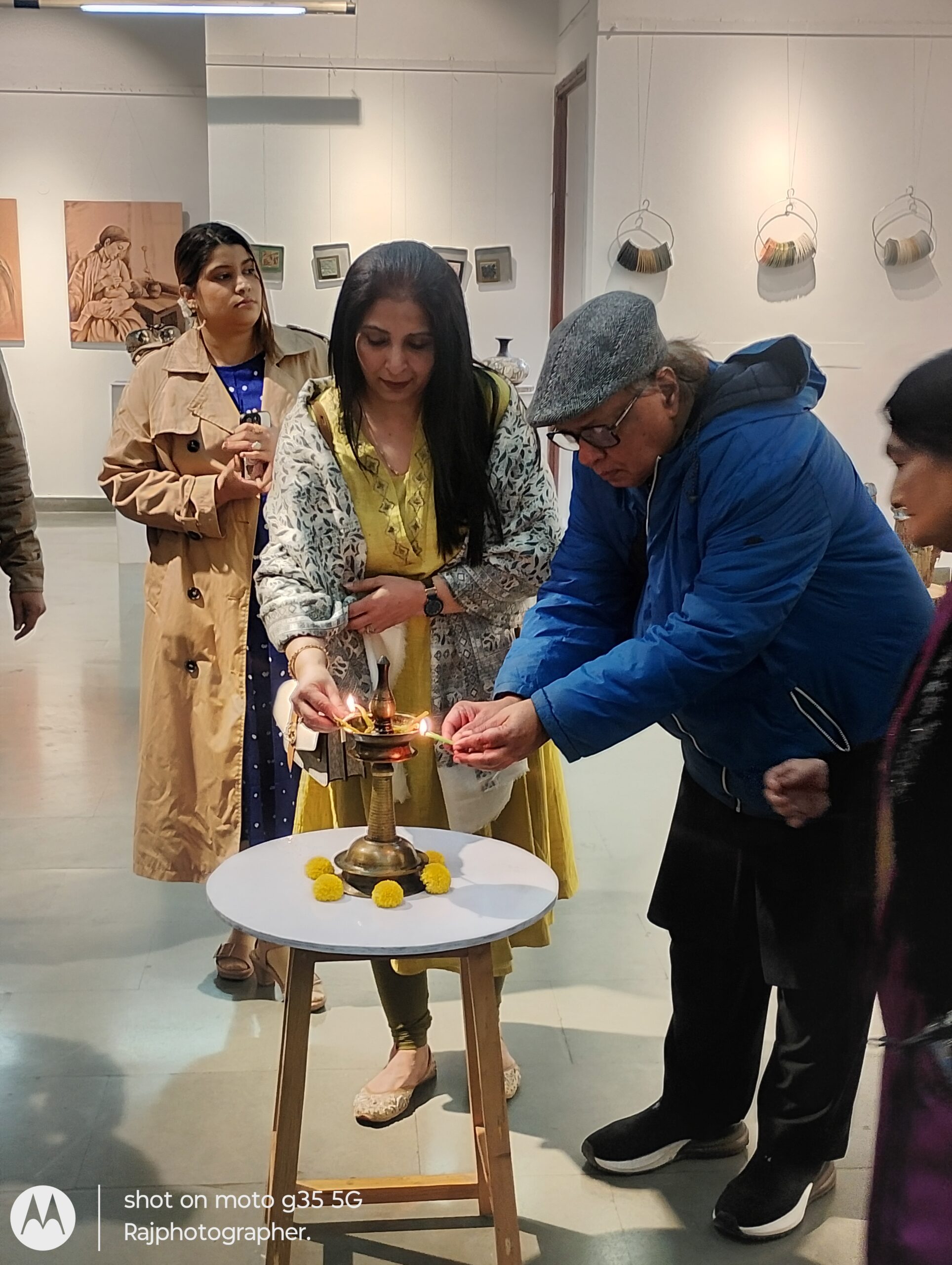 Vinod Bhardwaj lighting the lamp
