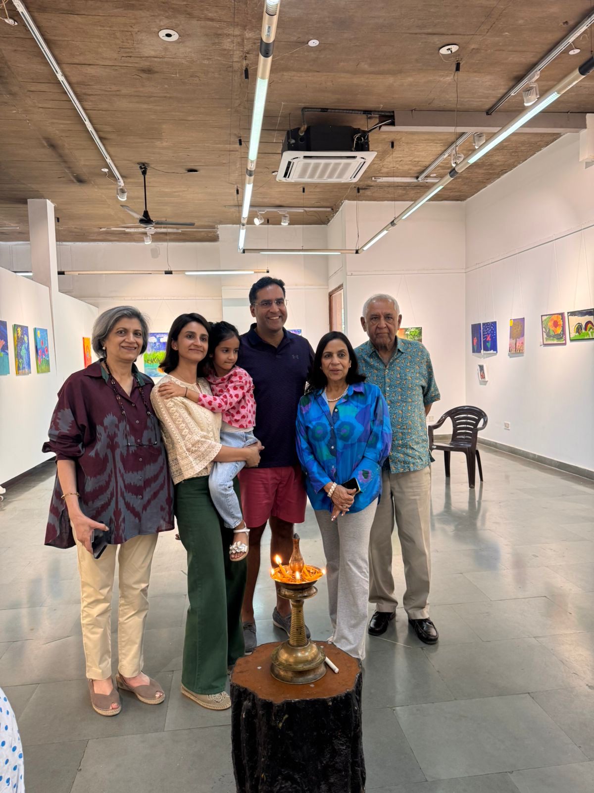 The baby artist with her parents and grandparents